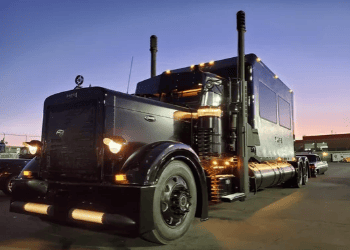 Custom black semi truck with enclosed trailer built by Ace of Spades Custom RV in Las Vegas
