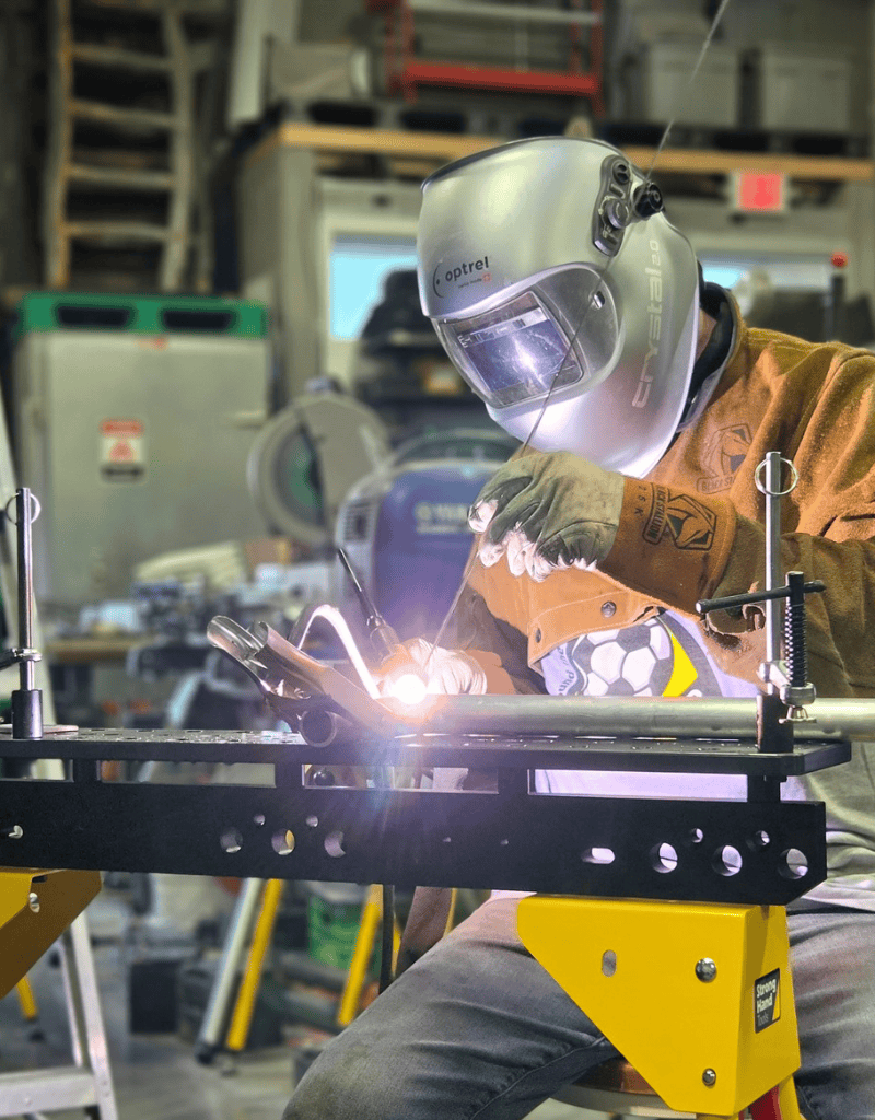 James West performing precision TIG welding on custom metal fabrication at Ace of Spades Custom RV Las Vegas